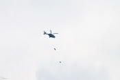 This is an Indian Air Force helicopter (When I zoomed in, I saw its Logo). Those are not bombs, they are Kites (birds)! :lol:  :lol:  :lol: This taken just outside my house. I fooled many people that those were bombs! (When I saw the image for the first time, I also thought those were bombs!)